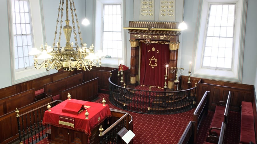 Torah scrolls with embroidered mantles